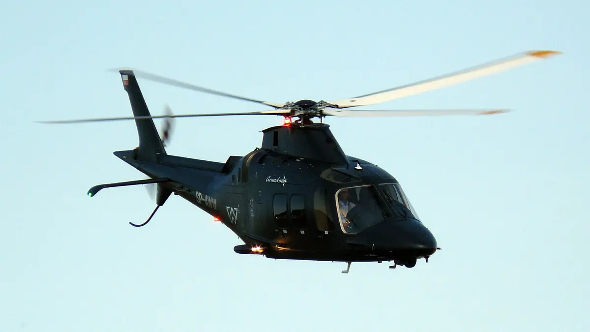 Leonardo AW109 twin-engine helicopter parked on a landing area, an example of a twin-engine charter type